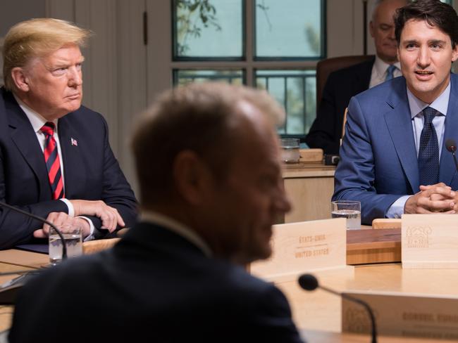 US President Donald Trump (L), President of the European Council Donald Tusk (C), and Canadian Prime Minister Justin Trudeau (R) participate in a working session. Picture: AFP/Saul Loeb