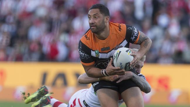 Benji Marshall runs the ball for the Tigers against the Dragons.