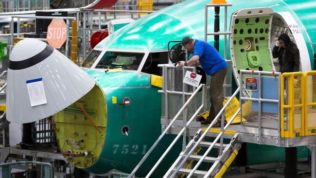 Employees work on Boeing 737 MAX airplanes at the Boeing factory in Renton, Washington in 2019. Picture: AFP