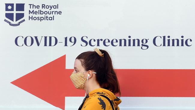 A woman queues outside a COVID-19 coronavirus testing venue at The Royal Melbourne Hospital. Picture: William West/AFP