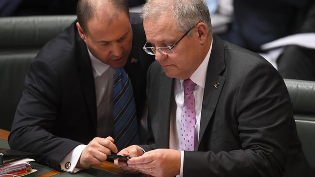 Josh Frydenberg and Scott Morrison find a welcome distraction from the shambles of the ‘It’s OK to be white’ motion. Picture: AAP