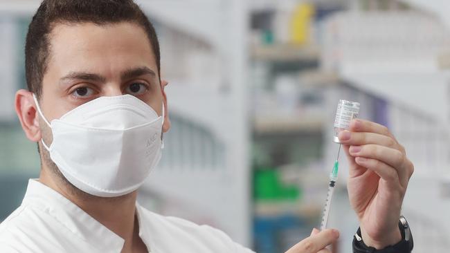 Pharmacies are now administering Novavax, Moderna and Pfizer. Pharmacist manager of Alive Pharmacy Westcourt Ahmed Bastawesy with a vial of the Moderna Covid-19 vaccine. Picture: Brendan Radke