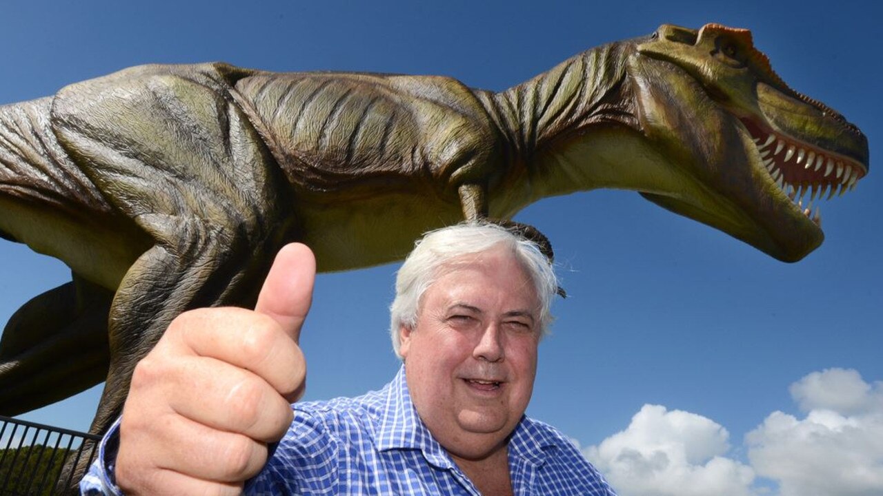 Clive Palmer outside at his Coolum resort in front of Jeff the dinosaur, who was destroyed in a fire in 2015.