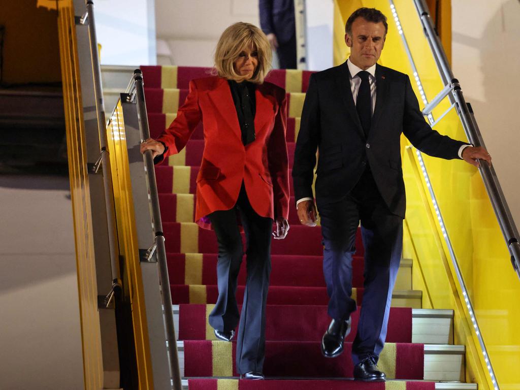The couple disembark the plane ahead of their Vietnam visit. Picture: Ludovic Marin/AFP