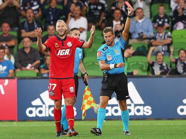 Dzengis Cavusevic of United is shown a red card by referee Alex King.