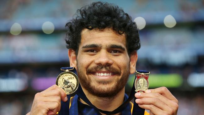 Cyril Rioli poses with his premiership and Norm Smith Medal after the 2015 AFL Grand Final match between Hawthorn and the West Coast Eagles. Picture: Michael Dodge/Getty Images