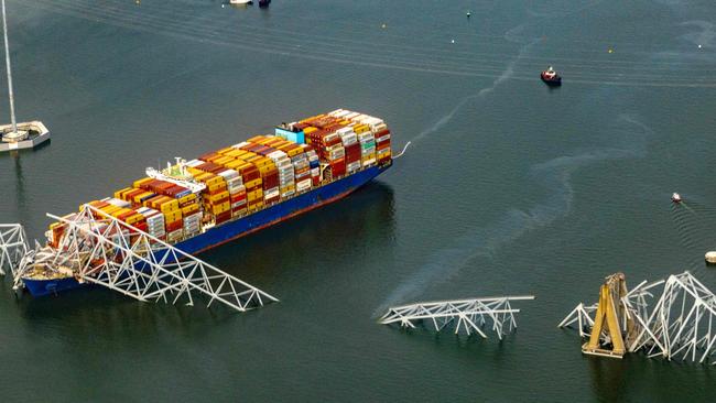 The cargo ship Dali with part of the structure over the hull after striking the Francis Scott Key Bridge. Picture: Getty Images via AFP.