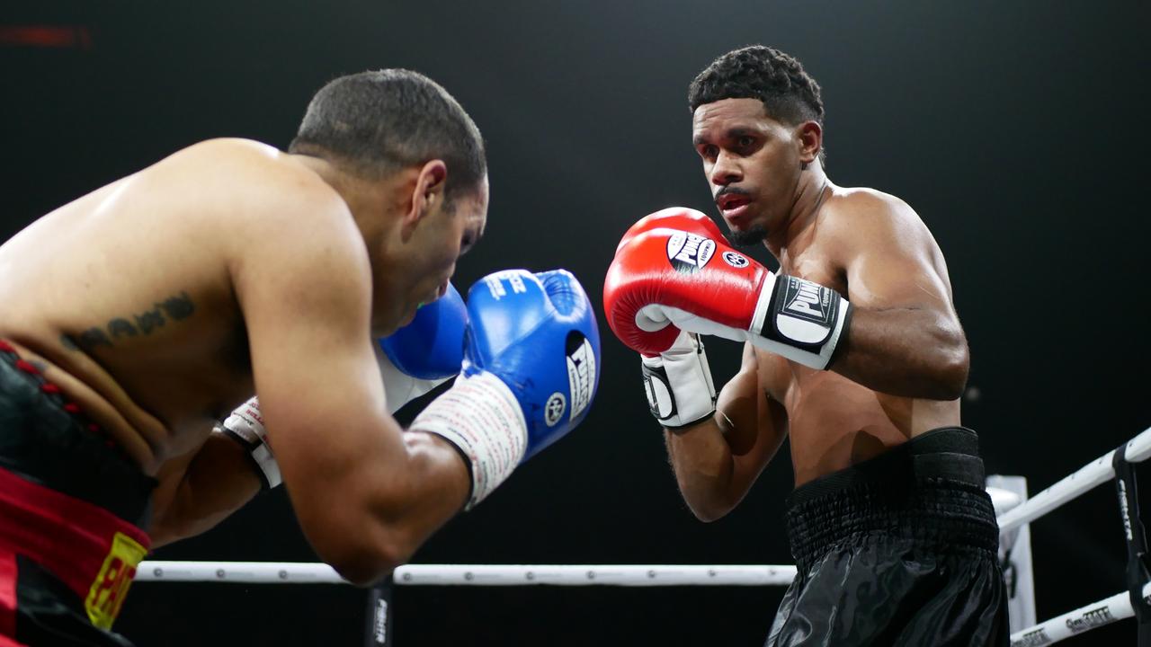 Patrick Clarke (red gloves) fights Alan Patterson (blue gloves) at the Battle of the Reef fight night at the Townsville Entertainment and Convention centre, October 7 2023. Picture: Blair Jackson.