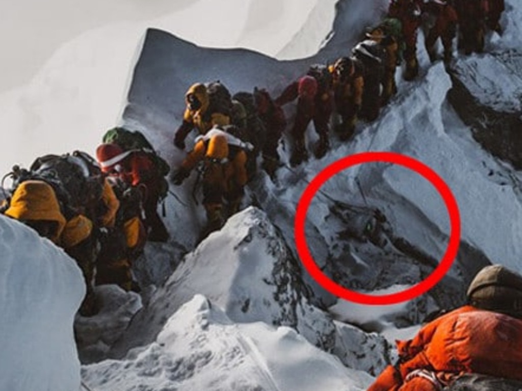Elia Saikaly’s disturbing photograph of a body on the side of Mt Everest as climbers queue for the summit.