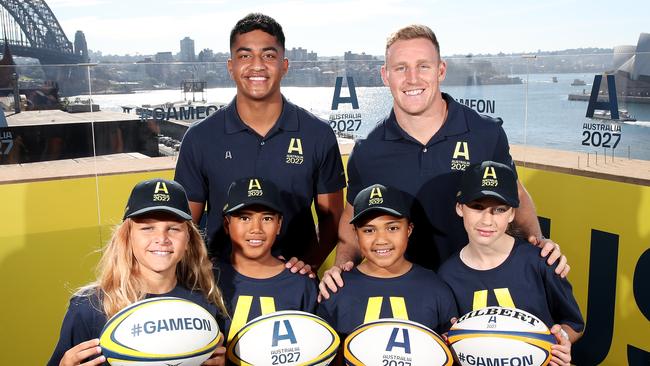 Waratahs player Clem Halaholo (L) with Wallaby Reece Hodge during the Australian Rugby World Cup 2027 bid launch.