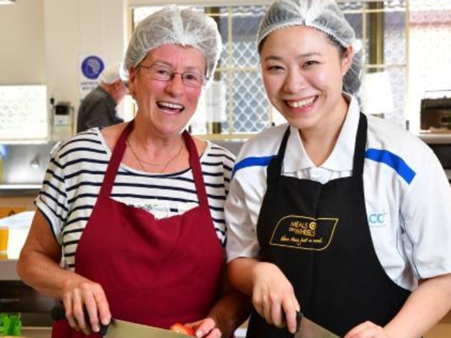 Preparing meals for delivery to clients.. Picture: Mark Brake