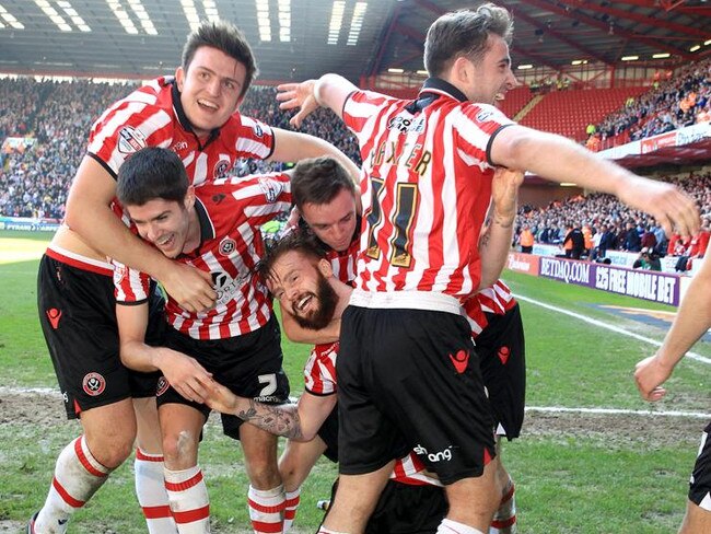 *ALTERNATE CROP* Sheffield United's John Brayford (centre) celebrates scoring their second goal of the game with team-mates .