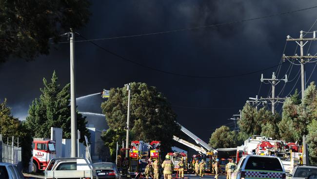 An out of control fire rages through factories around Thornycroft Street Campbellfield. Picture: Andrew Henshaw