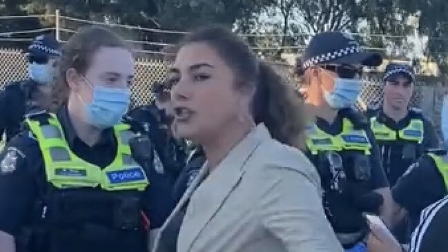 Greens Senator Lidia Thorpe screams abuse at police officers during a protest in Melbourne.