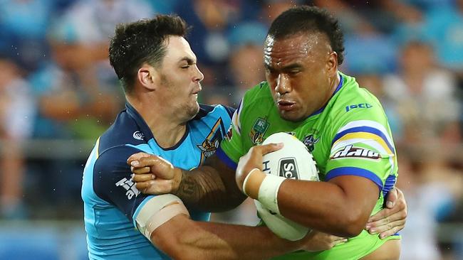 Raiders prop Junior Paulo charges into the Titans defence.