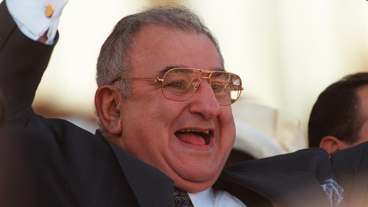 Racehorse owner Nick Moraitis in grandstand after his horse Might and Power won 1997 Melbourne Cup.