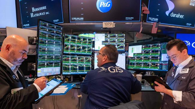 Traders work on the floor of the New York Stock Exchange with shares hitting fresh record highs through 2024. Picture: Getty/AFP