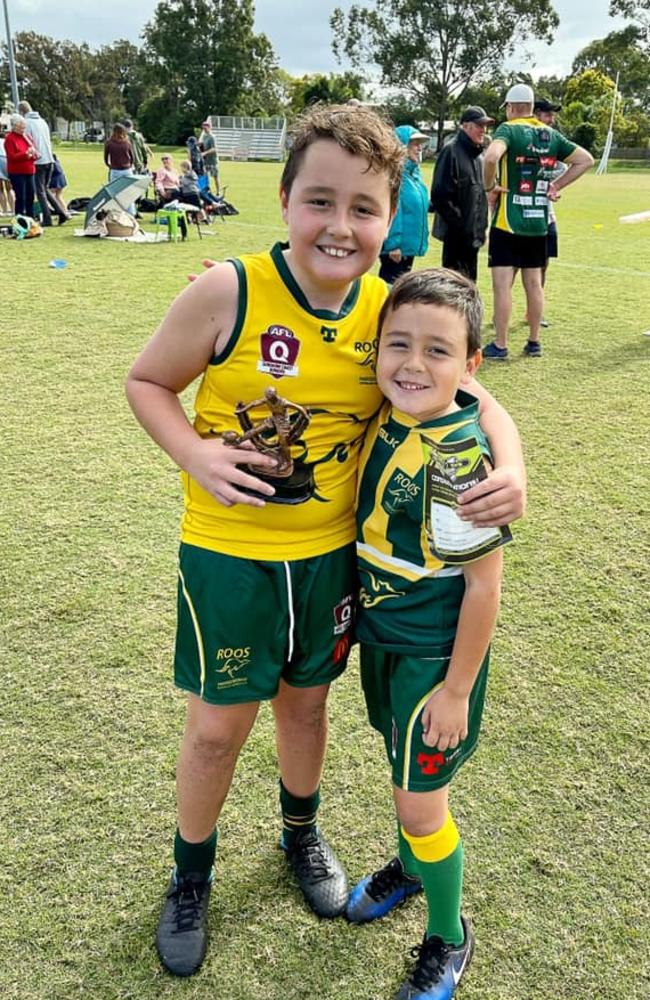 Maroochydore Roos fanatic Kurtis Scott, 10, with his younger brother Henderson.