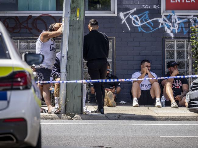 Grieving associates of ‘The Punisher’ in Preston on Monday morning. Picture: Jake Nowakowski