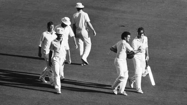 Mike Whitney and Craig McDermott, right, walk off after securing a draw for Australia against New Zealand at the MCG in 1987.