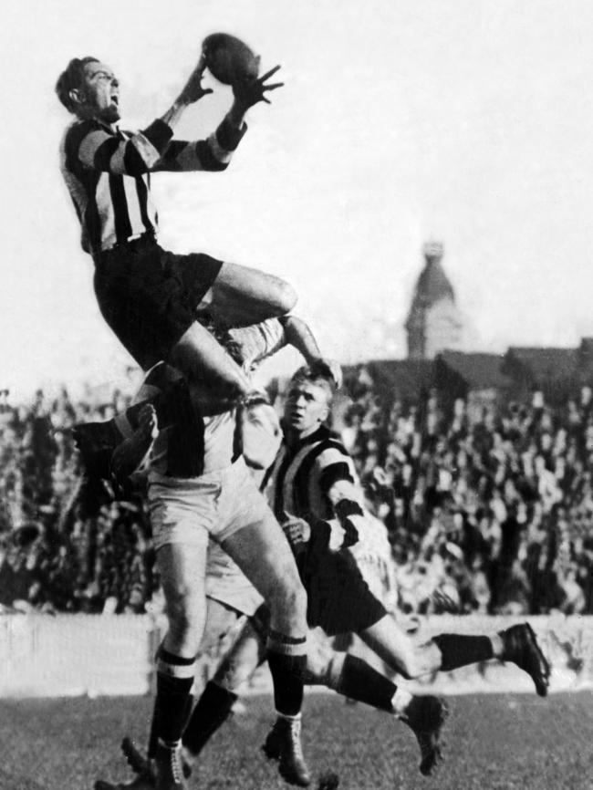 Collingwood's Ron Todd takes a spectacular mark at Victoria Park.