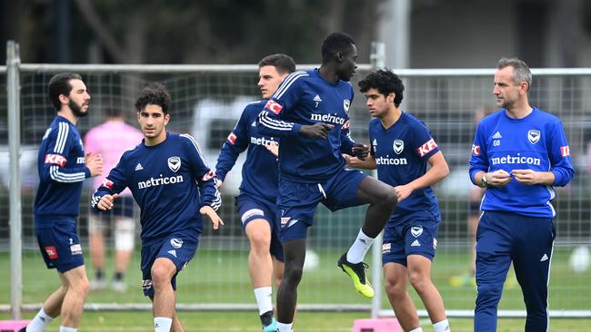 Grant Brebner (right) watches over a Melbourne Victory training session. Picture: Quinn Rooney/Getty Images