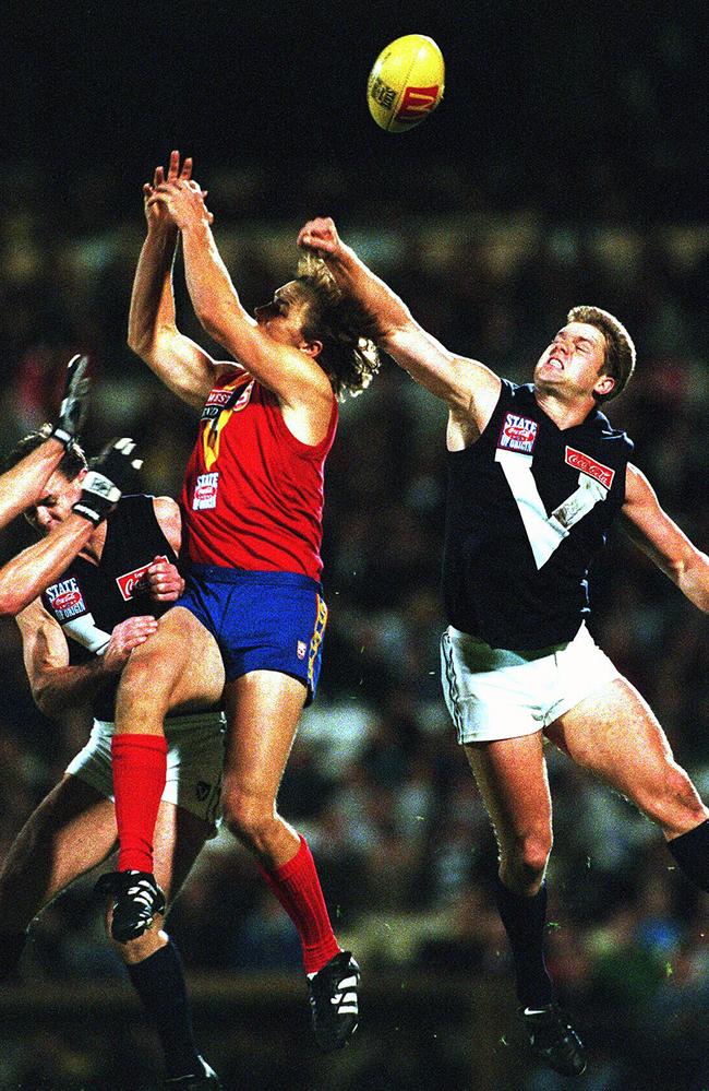 Glen Archer (rear) spoils Tony Modra mark during South Australia v Victoria AFL State of Origin game at Football Park in 1997.