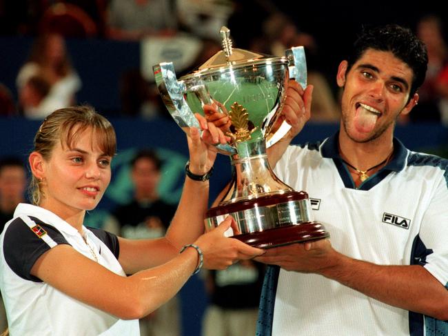 A star is born: Jelena Dokic holding the Hopman Cup trophy with Mark Philippoussis in 1999