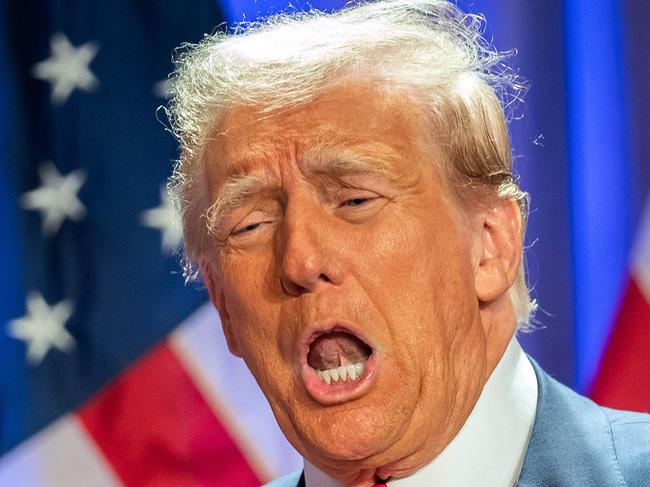 US President-elect Donald Trump gestures as he attends a meeting with House Republicans at the Hyatt Regency hotel in Washington, DC on November 13, 2024. (Photo by Allison ROBBERT / AFP)