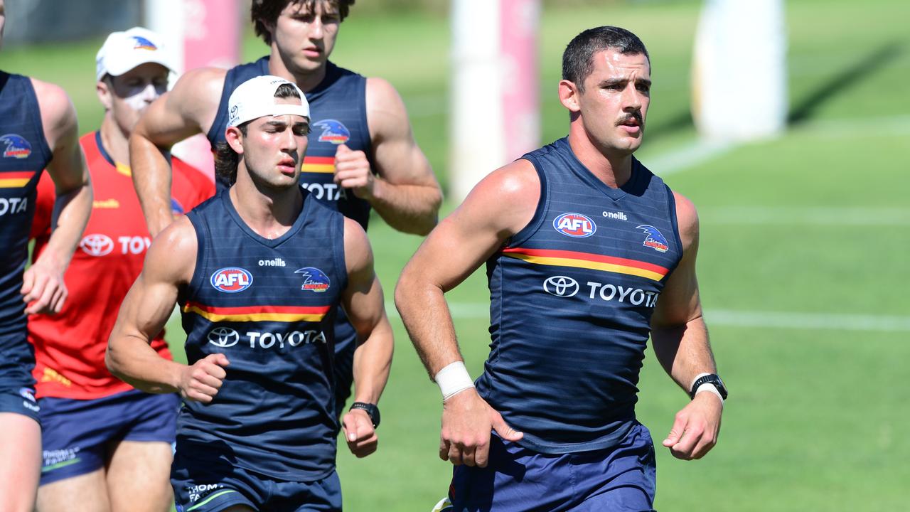 Crows draftee Josh Rachele running alongside Taylor Walker at pre-season training. Picture: Michael Marschall