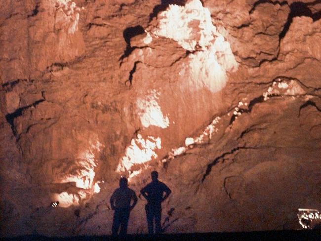 Ancient refuge ... Two men in the caves where Dead Sea Scrolls were discovered in Quamran. Source: NewsCorp