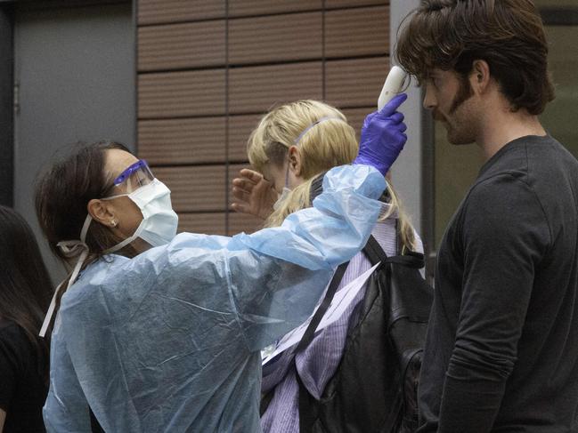 People queing at a coronavirus test at Royal Melbourne Hospital. Picture: Tony Gough