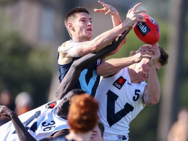 Ben De Bolfo marks over the pack. Picture: Michael Klein