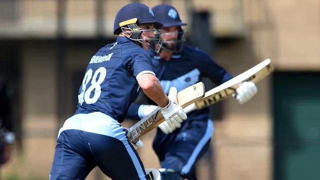 Kew pair Will Sheridan and Matt Brown run between the wickets. Picture: Steve Tanner