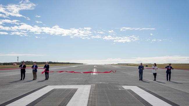 Ribbons are cut to officially launch the second runway on July 12 last year. Picture: Matt Williams