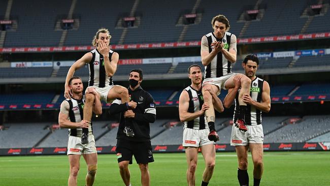 Chris Mayne was chaired off after his final game alongside 200-gamer Jordan Roughead. Picture: Quinn Rooney/Getty Images