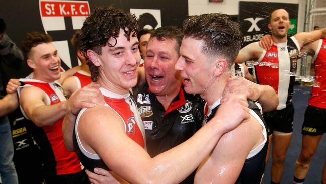 Nick Coffield and Doulton Langlands are joined in the middle of the circle by Brett Ratten in 2019 after their first wins for the club. (Photo by Darrian Traynor/AFL Photos/Getty Images)