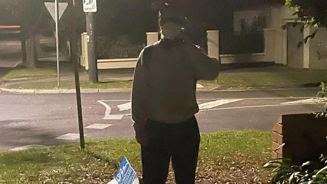 A photo taken of the suspect behind the alleged theft of a Tim Wilson campaign poster.