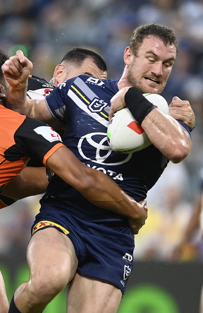 Coen Hess is tackled by Shawn Blore during round 18. (Photo by Ian Hitchcock/Getty Images)