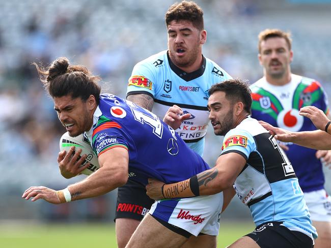 GOSFORD, AUSTRALIA - JULY 19: Tohu Harris of the Warriors is tackled during the round 10 NRL match between the New Zealand Warriors and the Cronulla Sharks at Central Coast Stadium on July 19, 2020 in Gosford, Australia. (Photo by Cameron Spencer/Getty Images)