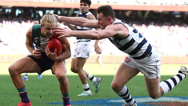 PERTH, AUSTRALIA - AUGUST 10: Patrick Dangerfield of the Cats tackles Corey Wagner of the Dockers during the round 22 AFL match between Fremantle Dockers and Geelong Cats at Optus Stadium, on August 10, 2024, in Perth, Australia. (Photo by Paul Kane/Getty Images)