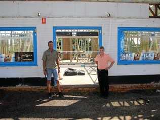 ON ITS WAY: Ross McPhee, right, stands with builder John Fazackerley out front of Rusty's fuel station. Picture: Dominic Elsome