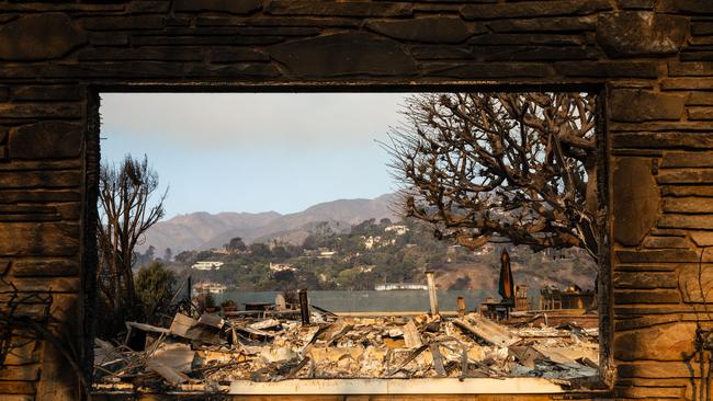 The rubble of a home destroyed in the Palisades Fire is seen through a window frame. Picture: AFP