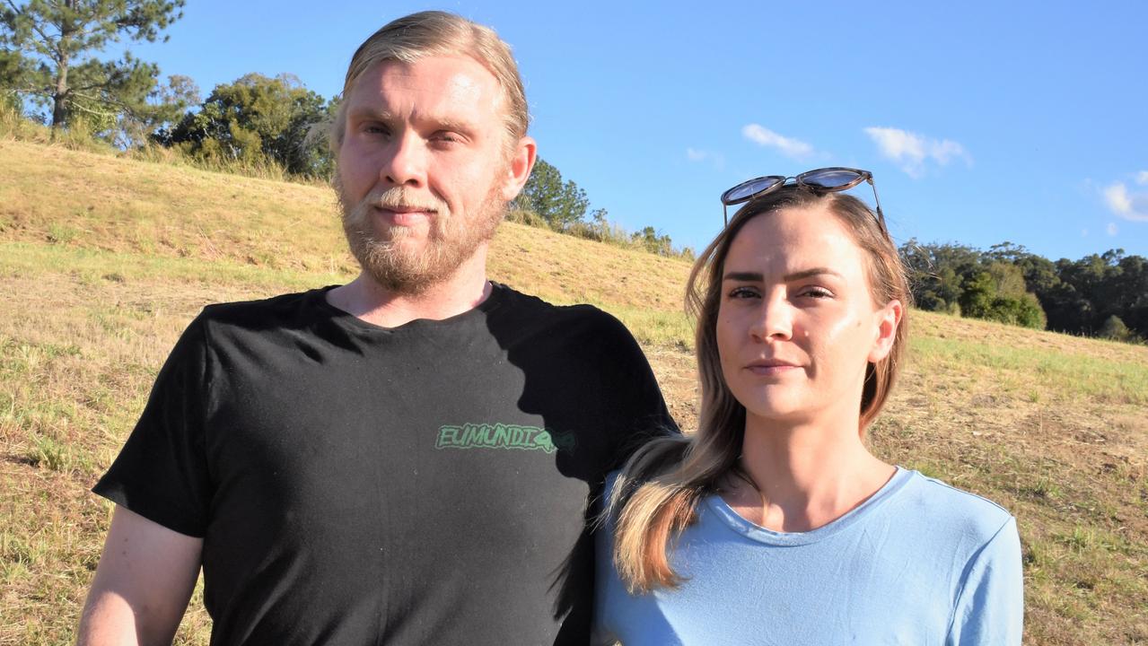 Elle Evans pictured with partner Jackson Mason has taken Burrell Developments after the company invoked the sunset clause to terminate her Eumundi land contract.