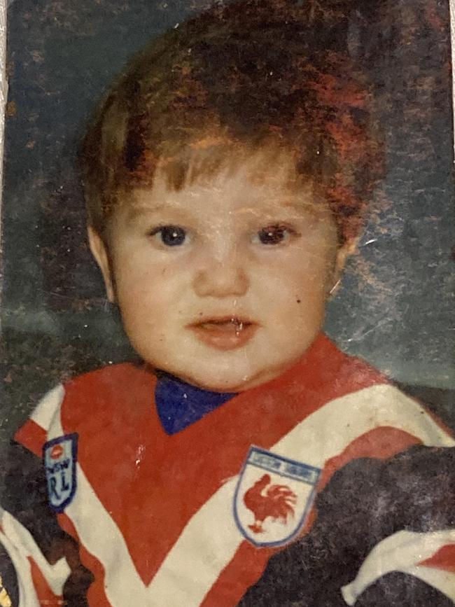 Australian cricketer Adam Zampa as a baby in Roosters jersey.