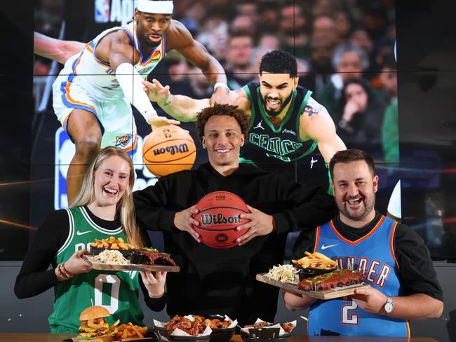 Dyson Daniels with NBA fans Kaylah Pangbourne and Caleb Hounihan with American style pub food at The Sporting Globe in Richmond. Picture: David Caird