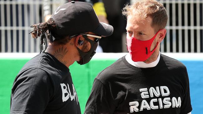 Lewis Hamilton of Great Britain and Mercedes GP and Sebastian Vettel