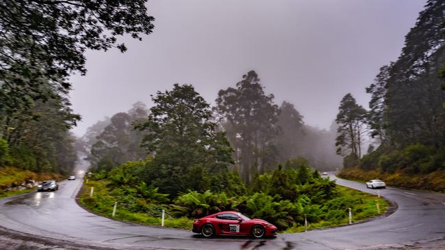 Victorian driver Michael Mansour and his Queensland navigator Paul Stuart drive through the Sideling in the 2020 Porsche Cayman. Picture: Other Side Productions Targa Tasmania 2022