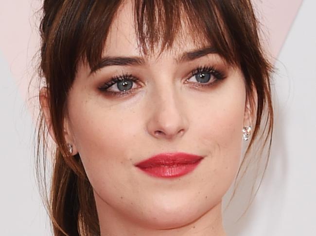 HOLLYWOOD, CA - FEBRUARY 22: Actresses Melanie Griffith (L) and Dakota Johnson attend the 87th Annual Academy Awards at Hollywood & Highland Center on February 22, 2015 in Hollywood, California. (Photo by Jason Merritt/Getty Images)