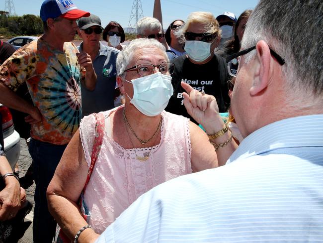 Nicolette Fitzgerald confronts Ian Hunter after he visited the site of Northern Power Station at Port Augusta. Picture: Calum Robertson